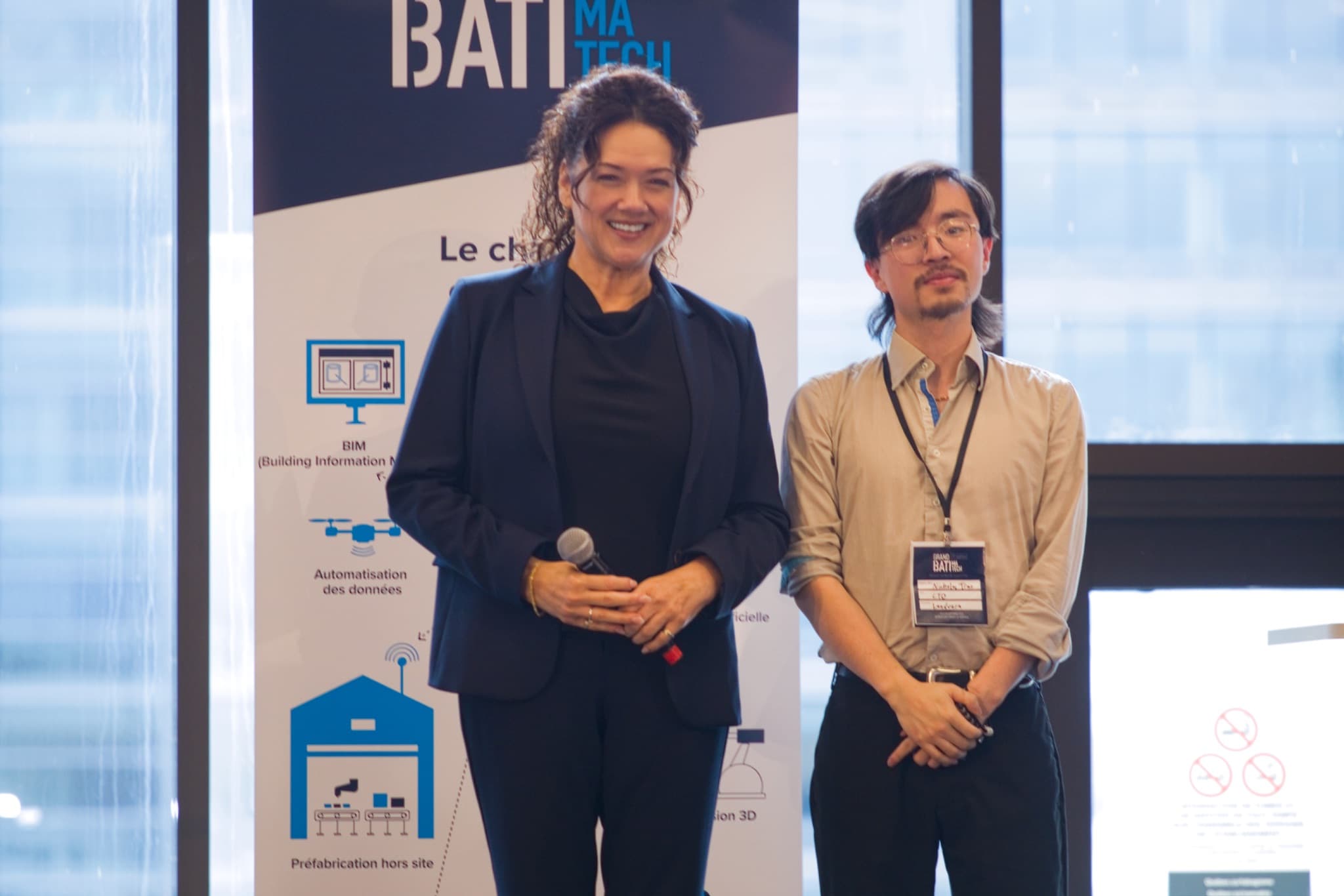 Justin Shum with a representative at the Batimatech PitchTech Innovation Construction event